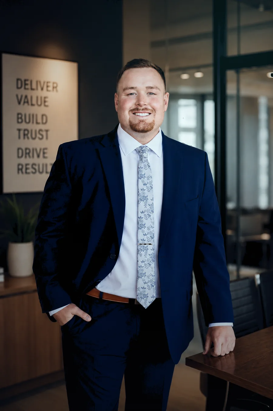 Chase Carpenter, founder of Syncra Labs, standing in an office